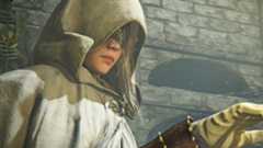 A cloaked Elden Ring Nightreign character lifts her hand and seemingly looks at it despite wearing a mask