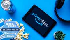 Prime Video logo appears on a tablet surrounded by a can of soda, spilled popcorn, headphones and a cactus with a Tom&#039;s Guide streaming deals badge.