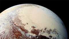 A planet with red patches and cream patches against a dark background.