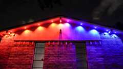 An underhead view showing a roof's ridge lit with Govee's Prism permanent outdoor lights