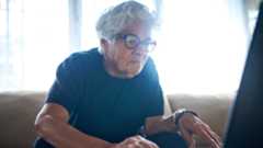 Elderly Woman Discovering New Technology