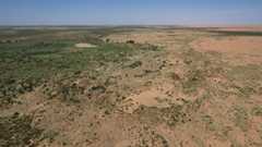 Aerial view of the edge of China's Kubuqi Desert where a large-scale tree planting effort is slowing desertification.