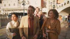 The team look shocked at something outside in The Studio