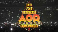 People lifting their hands up hold cell phone flashlights