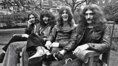 Black Sabbath in 1970, sitting on a park bench