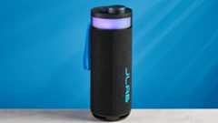 the jlab go party speaker in black with an LED RGB panel and jlab logo photographed in front of a blue background