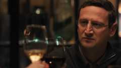 Tim Robinson as Ron Trosper, making a toast