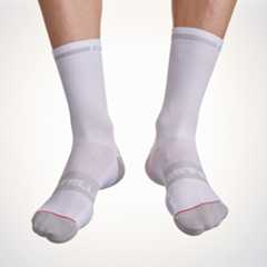 Male cyclist wearing the Castelli Superleggera T12 cycling socks