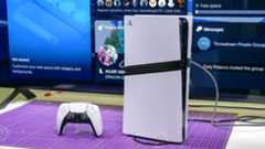 DualSense Controller and PS5 Pro in front of a TV screen