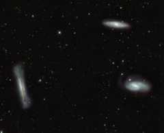 The famous Leo Triplet of spiral galaxies is located below the star Chertan in Leo. This image from the VLT Survey Telescope in Chile covers about 1 degree, or two full moon diameters, and will fit into an amateur telescope's field of view at low magnification. The three galaxies, each in a different orientation, are about 30 million light-years away.