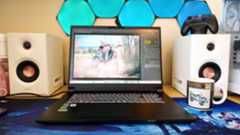 A black Overclockers Pinnacle laptop on a wooden desk