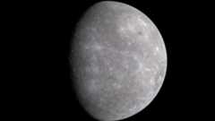 mercury appears as a gray and cratered planet against the black backdrop of space.