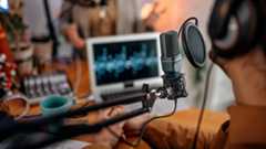 Shot of a podcasting microphone in a studio setting