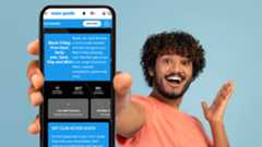 Holding a phone with TG rewards on it