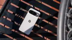 A white Google Pixel 10 Pro XL on a latticework black chair