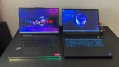 Alienware M18 and Asus ROG Strix Scar 18 gaming laptops side by side on a black desk