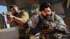 Black Ops 7 Season 1: An upper-body shot of two soldiers, weapons at the ready, cautiously walking towards the camera at the base of a staircase.