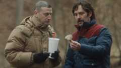 Craig Waterman (Tim Robinson) and Austin Carmichael (Paul Rudd) look at a mushroom in Friendship