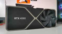 Nvidia RTX 4080 GPU sitting on white desk