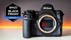 The Nikon Z8 on a white table with the Space.com Black Friday deal badge in the upper left corner.