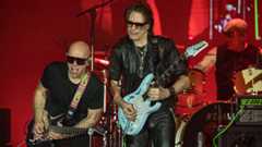  (L-R) Joe Satriani, Steve Vai, and Kenny Aronoff perform on stage at Harrah's Resort Southern California on May 10, 2024 in Valley Center, California