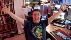 VFX YouTube channels; a man celebrates sat at a desk