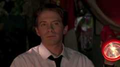 Seth Green in a white shirt and black tie in Without a Paddle