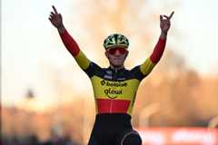 Belgian Thibau Nys celebrates as he crosses the finish line to win alone the men elite race at the World Cup cyclocross cycling event in Tabor, Czech Republic, stage 1 (out of 12) of the UCI World Cup cyclocross competition, Sunday 23 November 2025.BELGA PHOTO DAVID PINTENS (Photo by DAVID PINTENS / BELGA MAG / Belga via AFP)