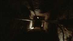 A shaky video showing a POV of someone running through a dark Egyptian tomb