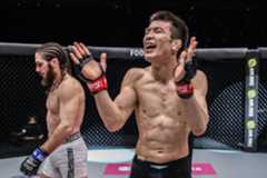 Japanese MMA fighter Shinya Aoki claps following his victory