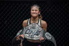 Stamp poses with the ONE Atomweight World Grand Prix title at ONE: WINTER WARRIORS.