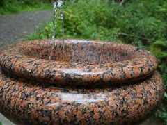 ferndell spring spouting into a granite basin