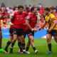 Rugby league fans react to Salford Red Devils victory as players celebrate a try