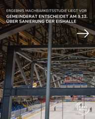 Dieser Alternativtext wurde KI-generiert: Ein Blick ins Innere einer großen, hallenartigen Struktur. Im Hintergrund ist eine Eisfläche mit Werbebanden und ein Anzeigetafel zu sehen.