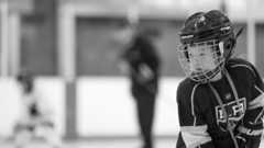 child playing hockey