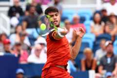 Carlos Alcaraz hits a tennis ball