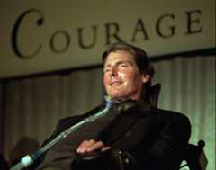 Actor Christopher Reeve excepts the 1996 National Courage Award given to him by the Courage Center, Sunday, Oct. 27, 1996, recognizing his service as an advocate for persons with disabilities in a ceremony at in Bloomington, Minn. Reeve is a quadriplegic after a spinal injury while riding a horse in May 1995. (AP Photo/Andy King)