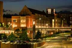 At night the Student Union stands brightly lit at the center of campus