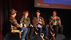 D23’s Justin Arthur, and Walt Disney Imagineers Susan Bonds, Daniel Jue, and Charita Carter share a laugh. Arthur and Jue are wearing brown fedoras reminiscent of Indiana Jones.