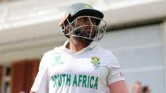 Temba Bavuma looks on