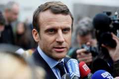 Emmanuel Macron, French presidential candidate, speaks to journalists in Bazainville, France, on April 18. Photo by Thomas...