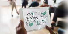 Person holding a tablet with psychology-themed illustrations, including discussions, problem-solving, and mental health symbols.