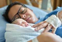 Asian mother with newborn baby in the hospital