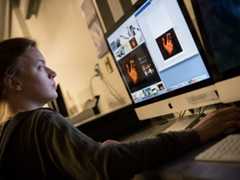 Art history student working on the computer