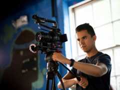 Cinema student sets up the camera