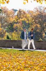 Students walking on Chapel Walk in the fall