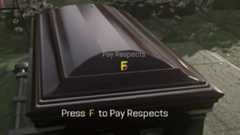 view of the coffin and the prompt on PC saying to press F to pay respects