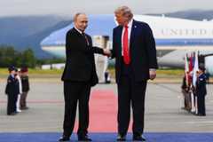 U.S. President Donald Trump greets Russia's President Vladimir Putin