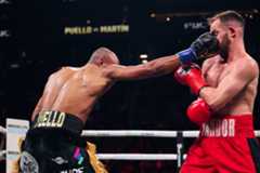 El brazo del  dominicano Alberto Puello (i) impacta en el rostro del español Sandor Martín: