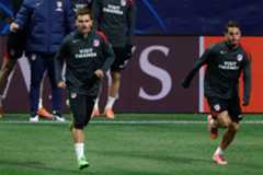 Griezmann y Koke, en el entrenamiento previo al duelo de Champions.